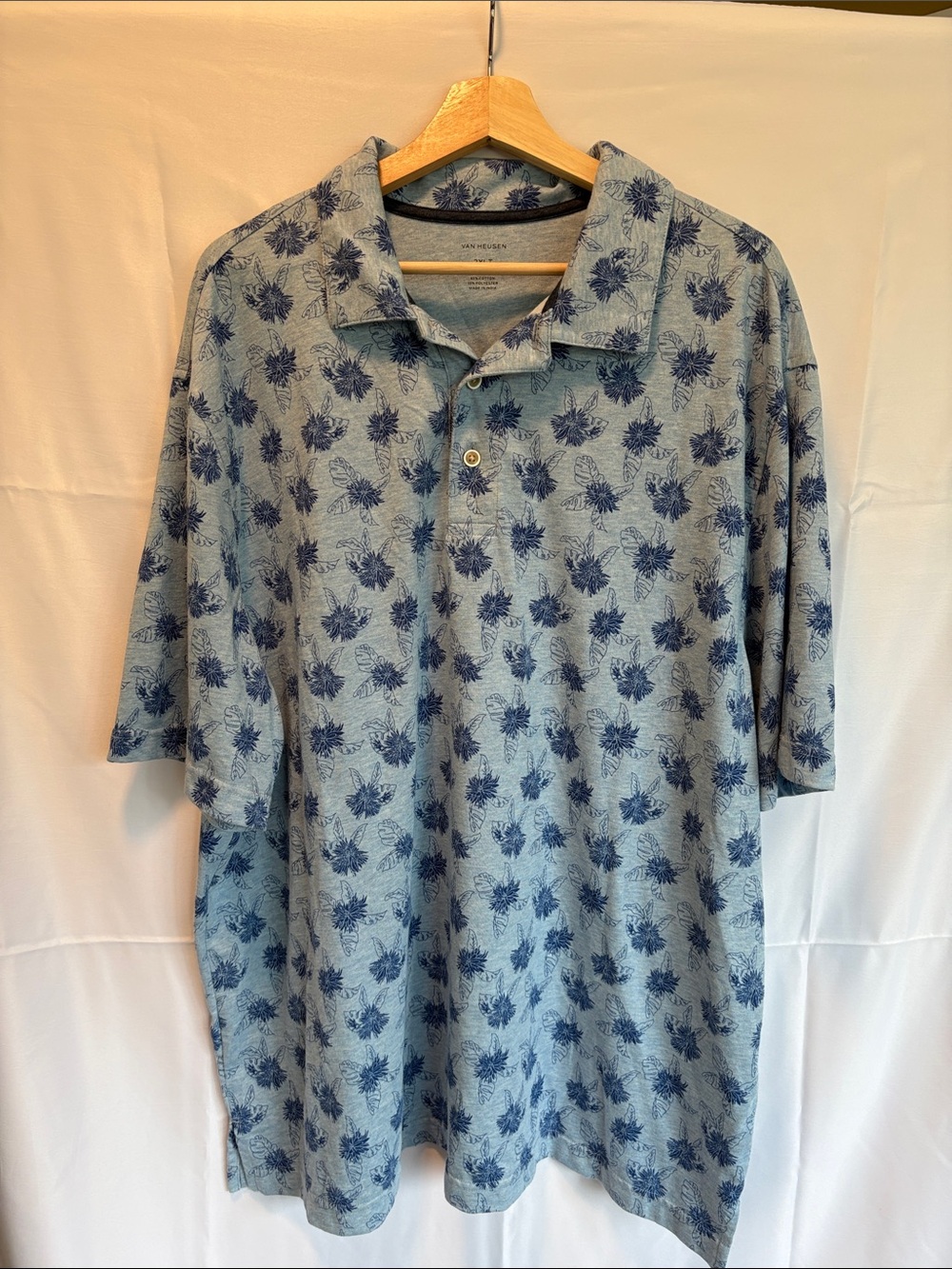 Van Heusen Light Blue Polo with Navy Print
Size: 2XLT